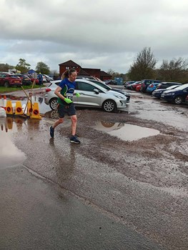 claire farrar trying to avoid the puddles.jpg